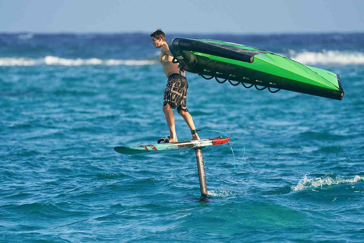 How do you stand up on a foil board?